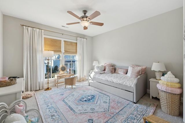 carpeted living room featuring ceiling fan and visible vents