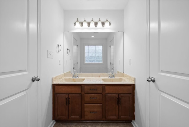 bathroom featuring double vanity and a sink