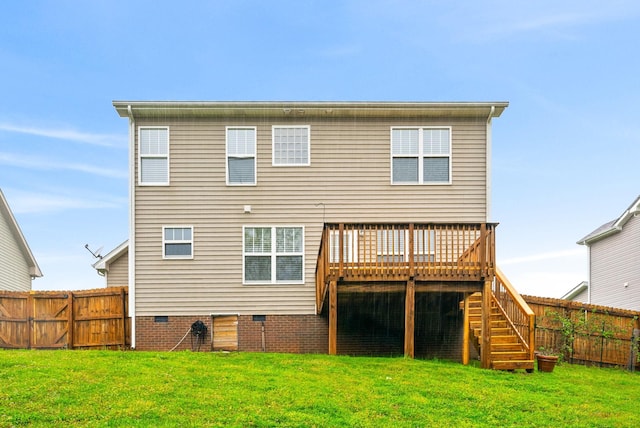 back of house with a deck, a yard, crawl space, fence, and stairs