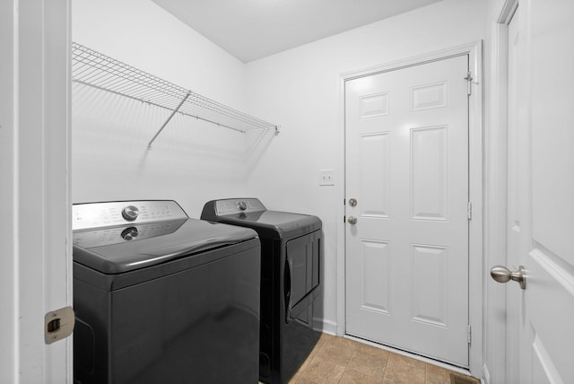 washroom featuring washing machine and dryer and laundry area