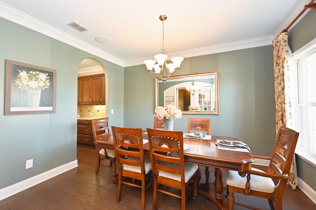1496 Foxland Blvd, Gallatin, TN 37066 - dining space with dark wood-style flooring, baseboards, an inviting chandelier, crown molding, and visible vents