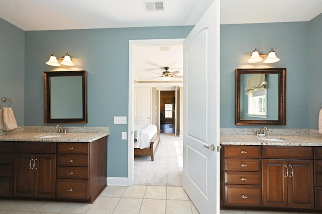 1496 Foxland Blvd, Gallatin, TN 37066 - ensuite bathroom featuring tile patterned floors, visible vents, a sink, and two vanities