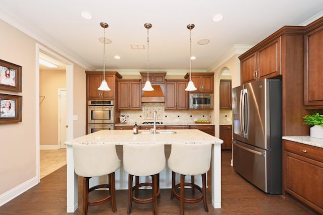 1496 Foxland Blvd, Gallatin, TN 37066 - kitchen featuring tasteful backsplash, appliances with stainless steel finishes, a kitchen bar, and crown molding