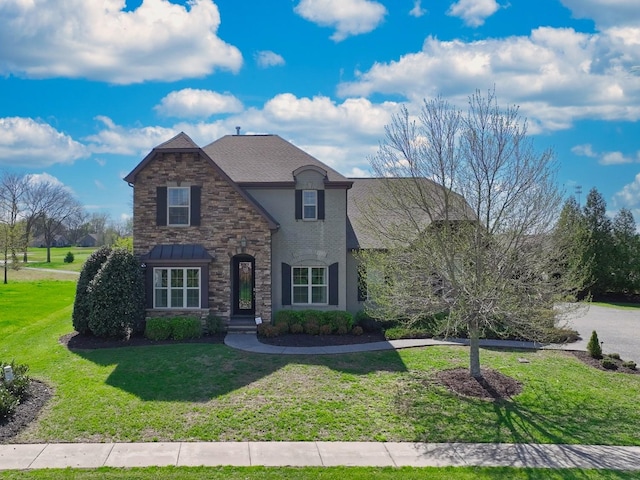 1496 Foxland Blvd, Gallatin, TN 37066 - french country home with a front yard, stone siding, and stucco siding