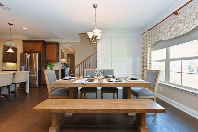 1496 Foxland Blvd, Gallatin, TN 37066 - dining area with an inviting chandelier, ornamental molding, visible vents, dark wood finished floors, and arched walkways