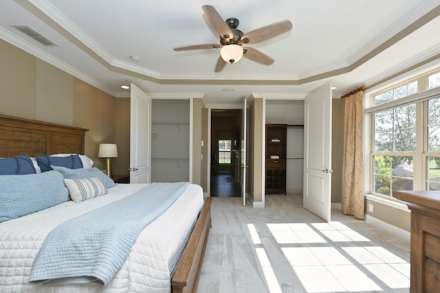 1496 Foxland Blvd, Gallatin, TN 37066 - bedroom featuring a tray ceiling, light carpet, multiple windows, and visible vents