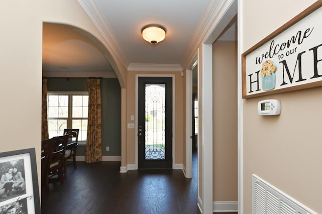 1496 Foxland Blvd, Gallatin, TN 37066 - foyer featuring visible vents, baseboards, arched walkways, dark wood-style floors, and crown molding