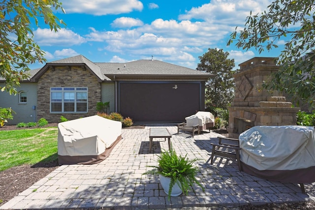 1496 Foxland Blvd, Gallatin, TN 37066 - view of patio / terrace featuring grilling area and an outdoor living space with a fireplace