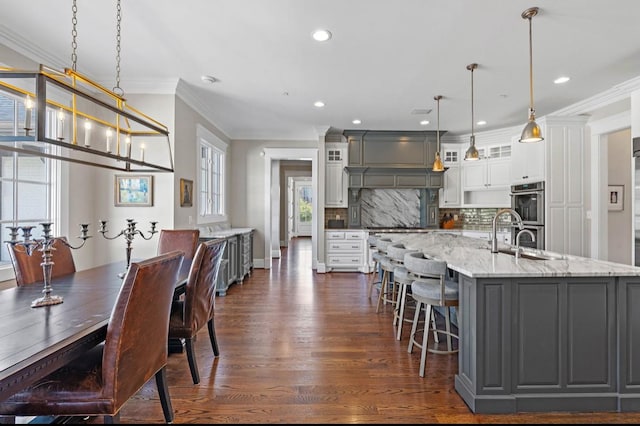 508 Huckleberry Rd, Nashville, TN 37205 - kitchen featuring double oven, ornamental molding, a sink, gray cabinetry, and backsplash