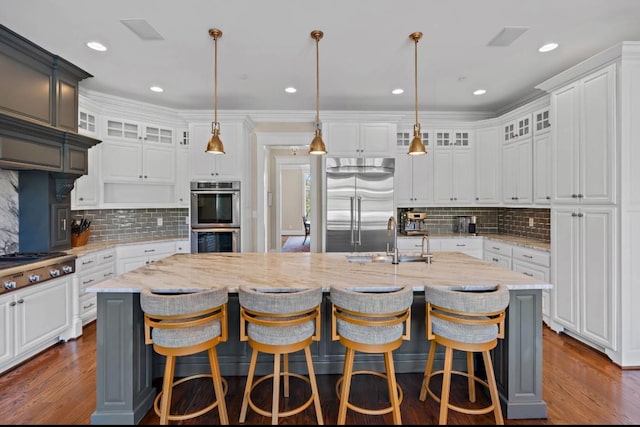 508 Huckleberry Rd, Nashville, TN 37205 - kitchen featuring a kitchen island with sink, white cabinetry, a sink, and appliances with stainless steel finishes