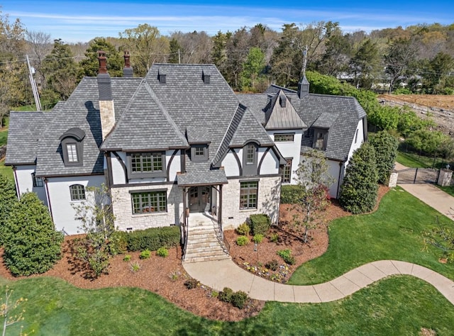 508 Huckleberry Rd, Nashville, TN 37205 - view of front of house with a chimney, stucco siding, stone siding, and a front yard