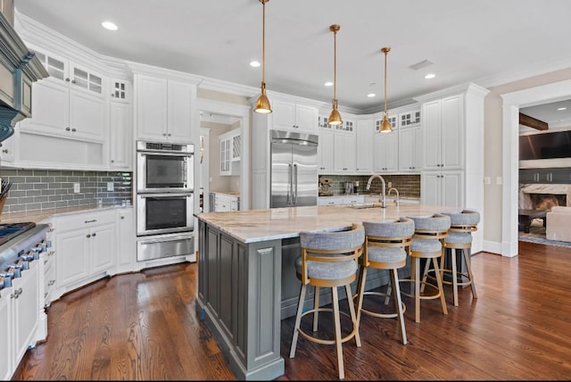 508 Huckleberry Rd, Nashville, TN 37205 - kitchen with white cabinets, a sink, dark wood finished floors, a warming drawer, and stainless steel appliances
