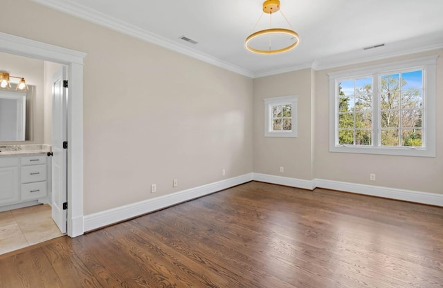 508 Huckleberry Rd, Nashville, TN 37205 - unfurnished bedroom with baseboards, ornamental molding, ensuite bathroom, light wood-style floors, and visible vents