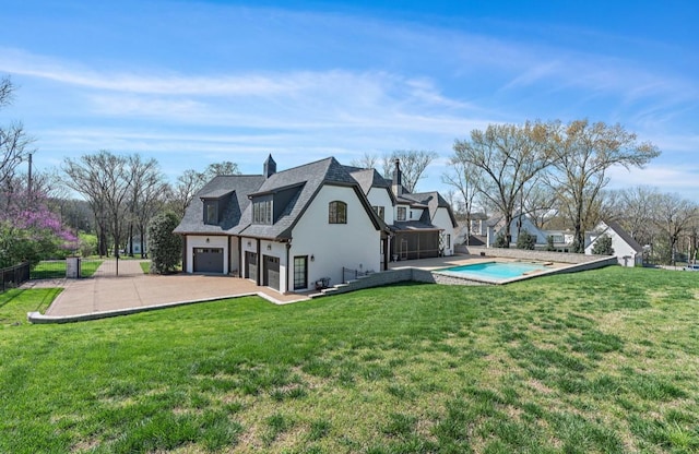 508 Huckleberry Rd, Nashville, TN 37205 - rear view of house featuring a yard, an attached garage, stucco siding, and concrete driveway