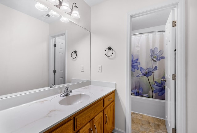 full bath with shower / tub combo, baseboards, and vanity