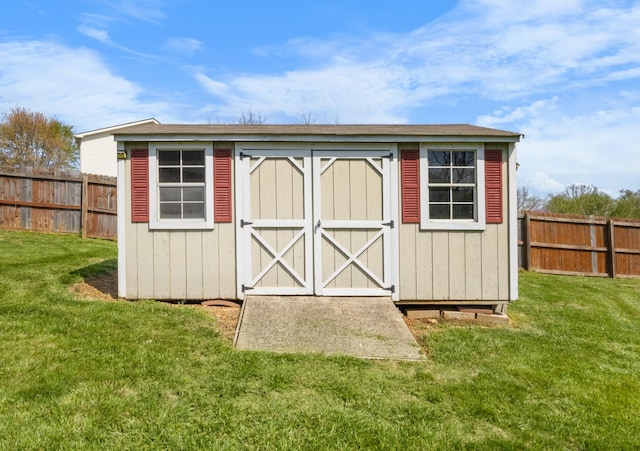 view of shed featuring a fenced backyard