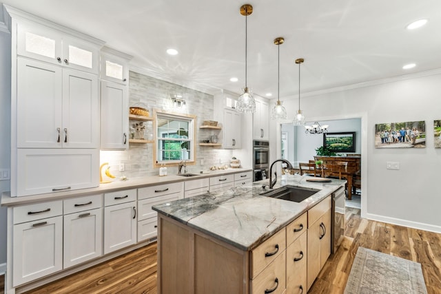 1132 Roseland Dr, Columbia, TN 38401 - kitchen with an island with sink, a sink, open shelves, appliances with stainless steel finishes, and ornamental molding
