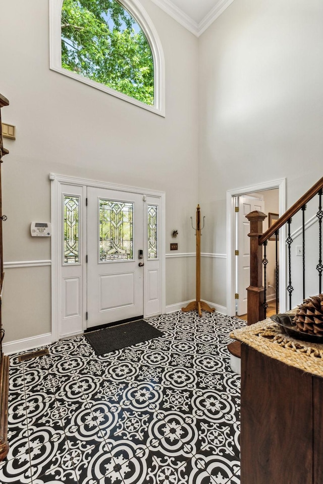 1132 Roseland Dr, Columbia, TN 38401 - entryway featuring baseboards, ornamental molding, a towering ceiling, and stairway