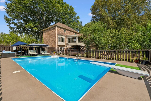 1132 Roseland Dr, Columbia, TN 38401 - view of swimming pool with a diving board, fence, a fenced in pool, and a patio area