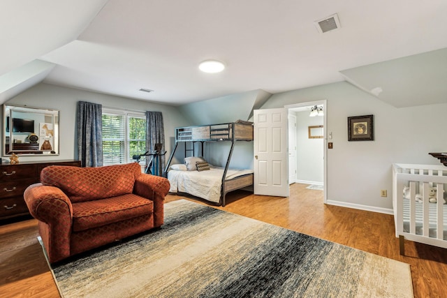 1132 Roseland Dr, Columbia, TN 38401 - bedroom with baseboards, visible vents, wood finished floors, and lofted ceiling