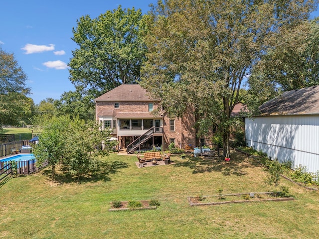 1132 Roseland Dr, Columbia, TN 38401 - back of property featuring stairway, fence, a yard, and brick siding