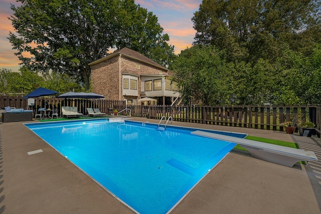 1132 Roseland Dr, Columbia, TN 38401 - view of swimming pool featuring a diving board, fence, a patio area, and a fenced in pool