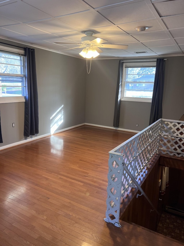 728 Robert Burns Dr, Nashville, TN 37217 - empty room featuring a ceiling fan, wood finished floors, and a healthy amount of sunlight
