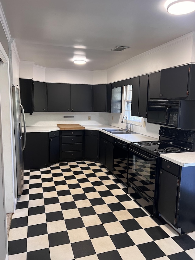 728 Robert Burns Dr, Nashville, TN 37217 - kitchen with dark cabinets, light countertops, black appliances, light floors, and a sink