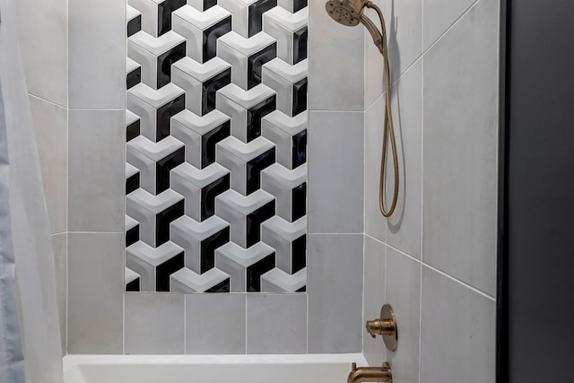 room details featuring shower / bathing tub combination