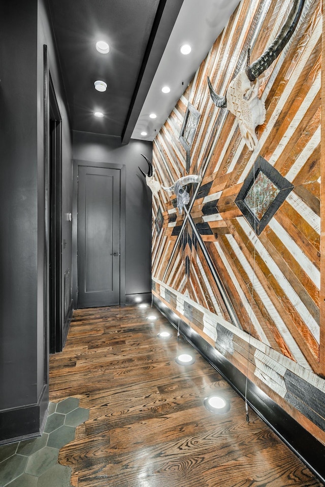 hall with recessed lighting, wood finished floors, and baseboards