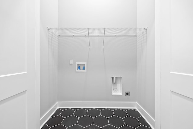 307 Riverview Dr, Dover, TN 37058 - washroom with baseboards, hookup for a washing machine, hookup for an electric dryer, and dark tile patterned flooring