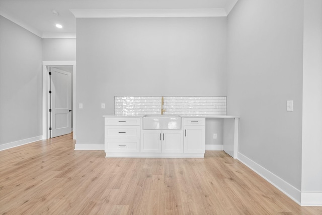 307 Riverview Dr, Dover, TN 37058 - interior space with ornamental molding, light wood-style floors, baseboards, and a sink