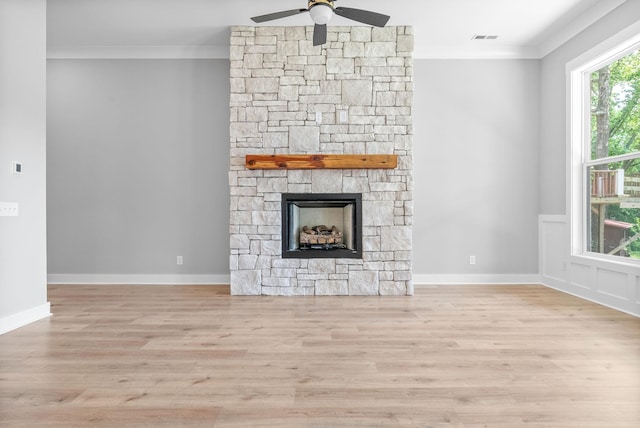 307 Riverview Dr, Dover, TN 37058 - unfurnished living room with ornamental molding, wood finished floors, ceiling fan, and a fireplace