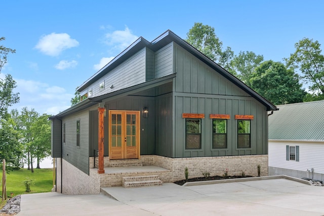 307 Riverview Dr, Dover, TN 37058 - rear view of house featuring french doors and board and batten siding