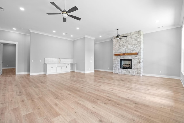 307 Riverview Dr, Dover, TN 37058 - unfurnished living room featuring a ceiling fan, ornamental molding, recessed lighting, baseboards, and light wood-type flooring