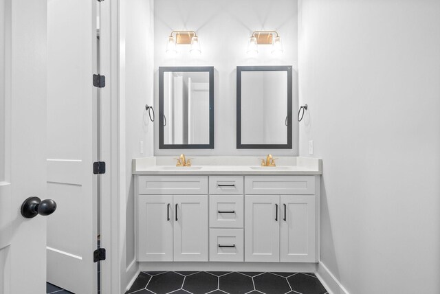 307 Riverview Dr, Dover, TN 37058 - bathroom featuring tile patterned floors, double vanity, and baseboards