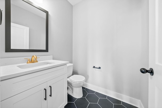307 Riverview Dr, Dover, TN 37058 - bathroom featuring vanity, toilet, tile patterned flooring, and baseboards