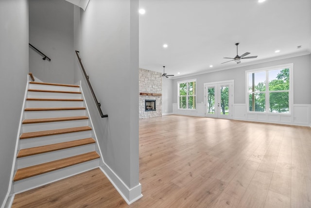 307 Riverview Dr, Dover, TN 37058 - unfurnished living room with a ceiling fan, light wood-style floors, recessed lighting, stairway, and a stone fireplace
