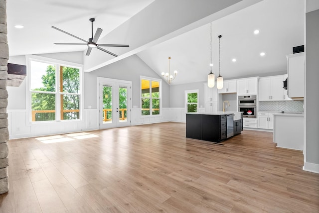 307 Riverview Dr, Dover, TN 37058 - kitchen featuring open floor plan, stainless steel appliances, ceiling fan, light countertops, and high vaulted ceiling