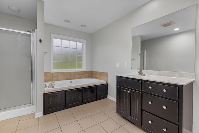 full bathroom featuring a shower stall, a bath, vanity, and tile patterned flooring