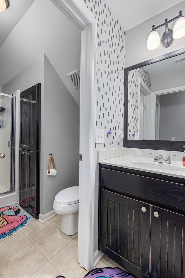 bathroom featuring vanity, a stall shower, tile patterned flooring, toilet, and visible vents
