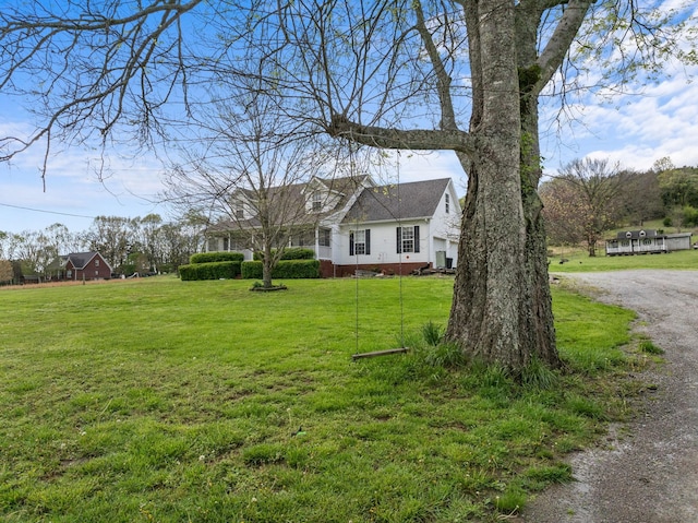 view of front of property featuring crawl space and a front lawn