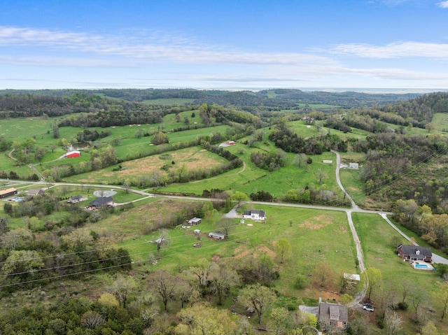 birds eye view of property with a rural view