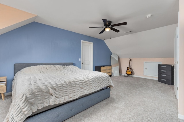 bedroom with carpet floors, baseboards, a ceiling fan, and lofted ceiling
