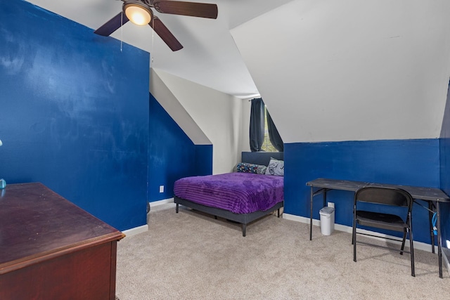 bedroom featuring carpet floors, baseboards, a ceiling fan, and lofted ceiling