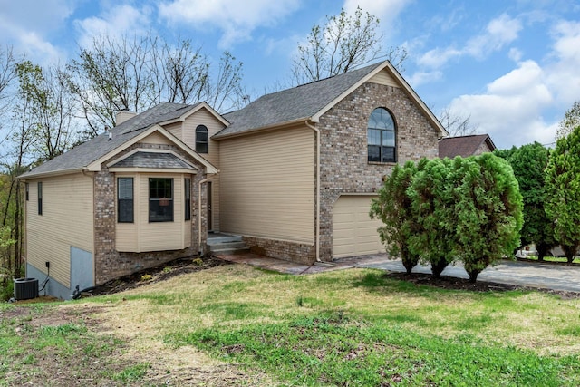 view of front of home with a front yard, a garage, brick siding, driveway, and roof with shingles