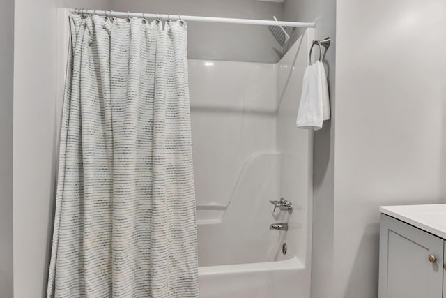 full bathroom with shower / bath combo with shower curtain and vanity