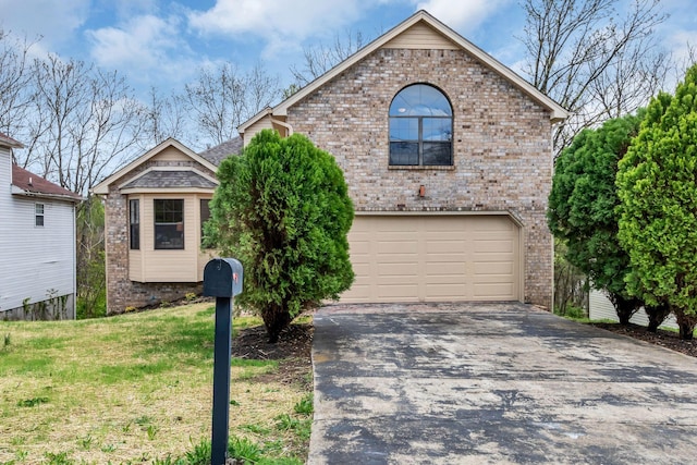 view of front of house with driveway, an attached garage, a front yard, brick siding, and a shingled roof