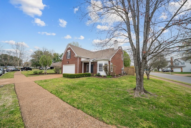 view of front of home with a chimney, driveway, a front lawn, brick siding, and a garage