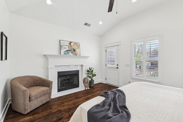 926 Acklen Ave Unit A, Nashville, TN 37203 - bedroom featuring visible vents, a brick fireplace, recessed lighting, wood finished floors, and lofted ceiling